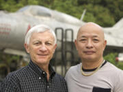 Opposing Vietnam War fighter pilots Dan Cherry, left, and Nguyen Hong My in 2008.