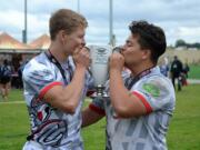 Rees Alferd, left, and Hayden Ramsay celebrate winning the Rugby Oregon Varsity Premiership title on Saturday, May 21, 2016 at Portland's Delta Park.