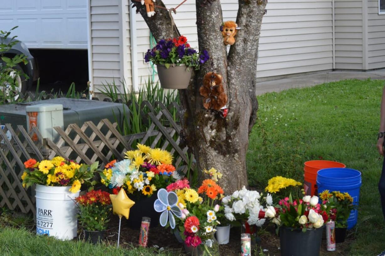 A memorial grows in front of the home of a 3-year-old Battle Ground boy who was killed Monday night by his mother&#039;s boyfriend, Ricardo Gutierrez.