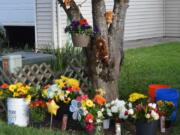 A memorial grows in front of the home of a 3-year-old Battle Ground boy who was killed Monday night by his mother&#039;s boyfriend, Ricardo Gutierrez.