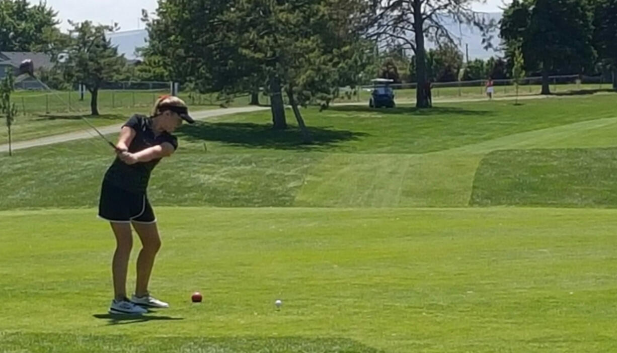 Camas golfer Elise Filuk tees off at the 18th hole Wednesday at the 4A girls state golf championship in Pasco. Filuk tied for sixth and led Camas to a second-place team trophy.