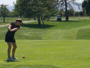 Camas golfer Elise Filuk tees off at the 18th hole Wednesday at the 4A girls state golf championship in Pasco. Filuk tied for sixth and led Camas to a second-place team trophy.