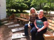 Don and Cindy Bradley, caretakers at the Palestine Gardens, pose for a portrait on April 22 in Lucedale, Miss.