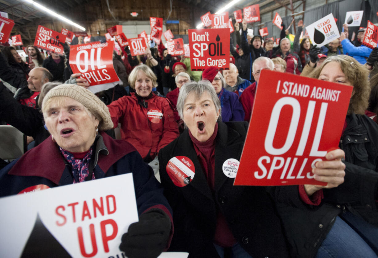 One among hundreds of demonstrators, Maureen Hildreth, center, voices her opposition to the Vancouver Energy oil terminal at an anti-terminal rally Jan. 5 at the Clark County Event Center at the Fairgrounds. The campaign Stand Up To Oil organized the rally, and others like it, to tap into the strong regional distaste for fossil fuel projects.