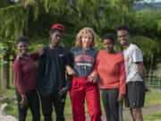 Members of the Griffith family pose for a portrait on their Ridgefield farm. Pictured from left: Jennica Griffith, 12, Samson Griffith, 15, mom Julia Griffith, Mirlie Griffith, 18, and Silas Griffith, 17. Not pictured are Billy, 17; Abraham, 20, and Abby, 22.