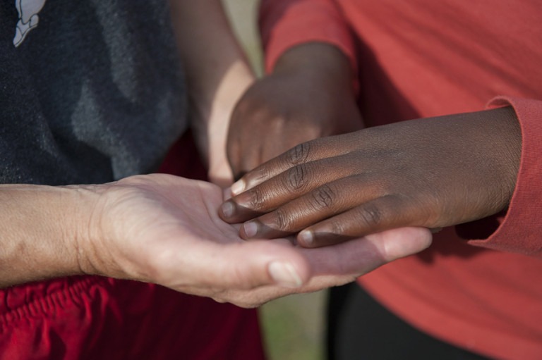 Julia Griffith joins hands with her daughter, Mirlie, 18, on their Ridgefield farm.