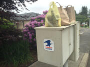 Bags of food await pickup Saturday for the annual letter carriers food drive, Clark County&#039;s second-largest food drive. This year, an estimated 100,000 pounds of food was collected.