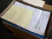 A box of signed petitions is seen May 1 at Vancouver City Hall.