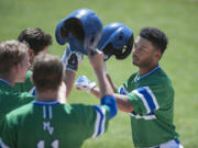 Mountain View&#039;s Preston Jones, right, celebrates with teammates after hitting a home run in the first inning Saturday afternoon, May 7, 2016 at Propstra Stadium.