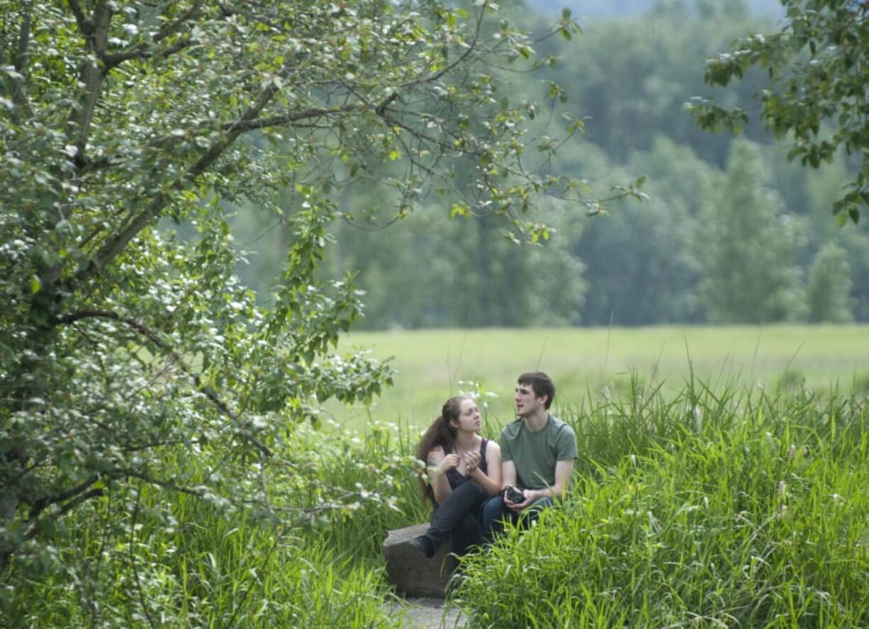 Anna and Ronald Curtman take in nature at the Steigerwald Lake National Refuge. An $18 million project calls for making the refuge more inviting for both humans and wildlife.