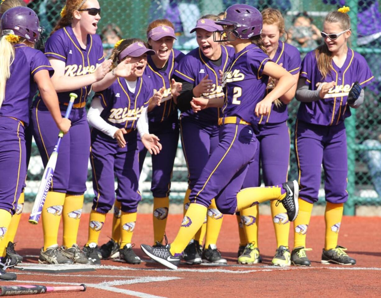 Columbia River&#039;s  Izzy Parker (2) is met at home plate after hitting a two-run homer against Eastside Catholic during the 2016 3A State Championships May 27, 2016 at Regional Athletic Complex in lacy Washington. The Chieftains beat the Crusaders 10-7.