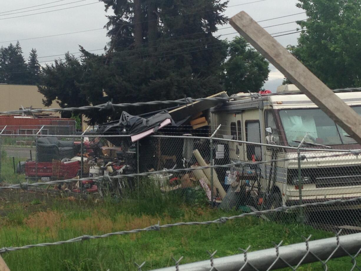 Clark County and Vancouver law enforcement officers arrested two Vancouver men on methamphetamine charges after a search at this suspected drug house, across the street from Covington Middle School, Wednesday.