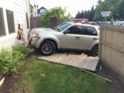 No one was hurt when this SUV crashed through a fence and into a home in the Felida area Monday morning.