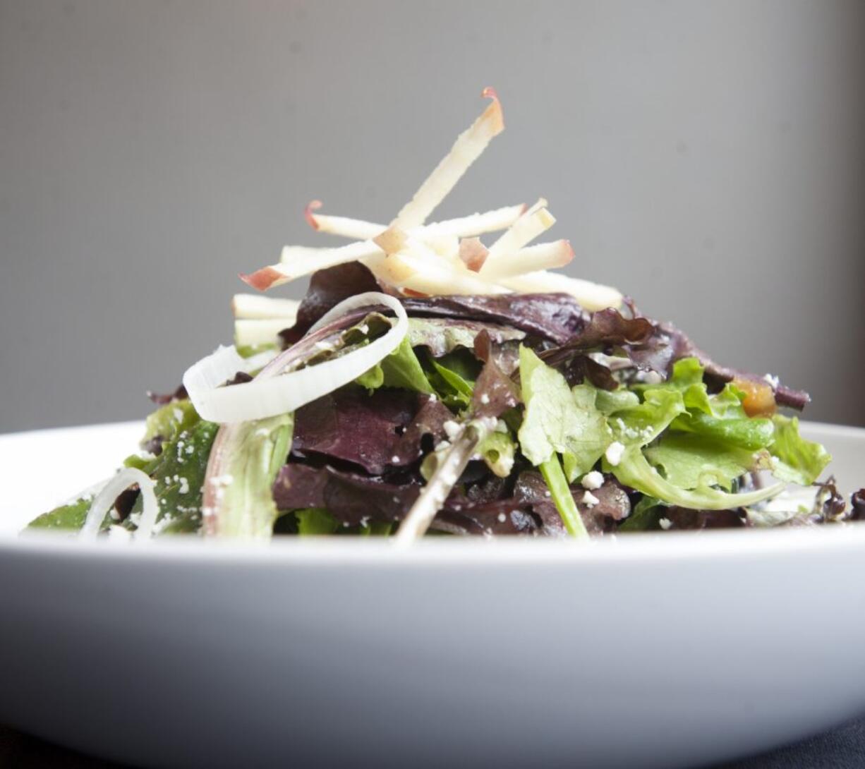 A spring mix salad is served at the Pioneer Street Cafe in Ridgefield. The salad is made of apples, spiced candied pecans, gorgonzola, shaved leeks and mixed greens, tossed in a sherry vinaigrette.