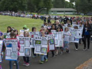 A threat of showers held off as the students marched around the Fort Vancouver National Site, above.