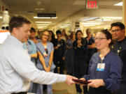 North Garrison Heights: PeaceHealth Southwest Medical Center nurse Amy Ciecko, right, receiving the David Lloyd Exceptional Nurse Award.