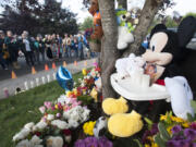 Friends, neighbors and other community members attend a vigil Friday evening in Battle Ground for Jose &quot;Pepe&quot; Castillo-Cisneros, who was killed earlier this week. Pepe, who had autism, loved Mickey Mouse.