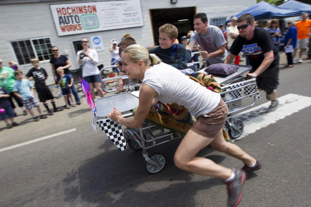 Erica Vossler of the &quot;The Holy Rollers&quot; team from the Elim Lutheran Church takes part in the bed races at Hockinson Fun Days in 2014.