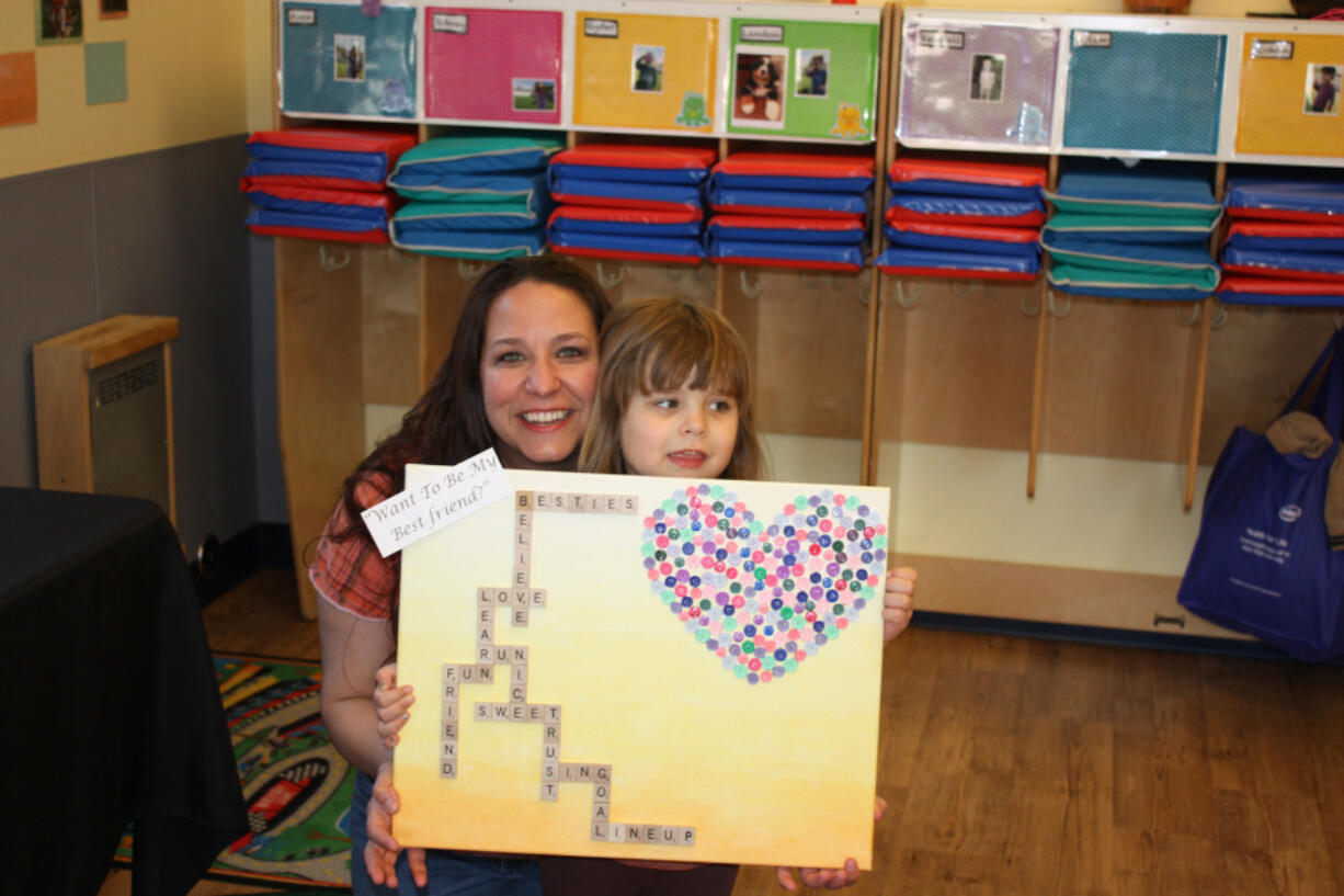 Salmon Creek: Mom Phaedra and daughter Izzy Karoy at The Goddard School&#039;s Children&#039;s Art Gala.