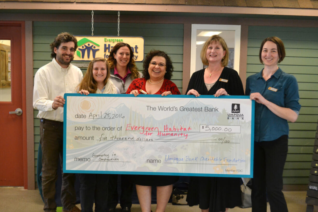 Ellsworth Springs: Josh Townsley, from left, Leanna Sabian, Amy Lodholz, Mojgan Kasraei, Lori Wick and Anthea Proulx with $5,000 check presented by Umpqua Bank to Evergreen Habitat for Humanity.