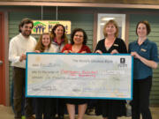 Ellsworth Springs: Josh Townsley, from left, Leanna Sabian, Amy Lodholz, Mojgan Kasraei, Lori Wick and Anthea Proulx with $5,000 check presented by Umpqua Bank to Evergreen Habitat for Humanity.