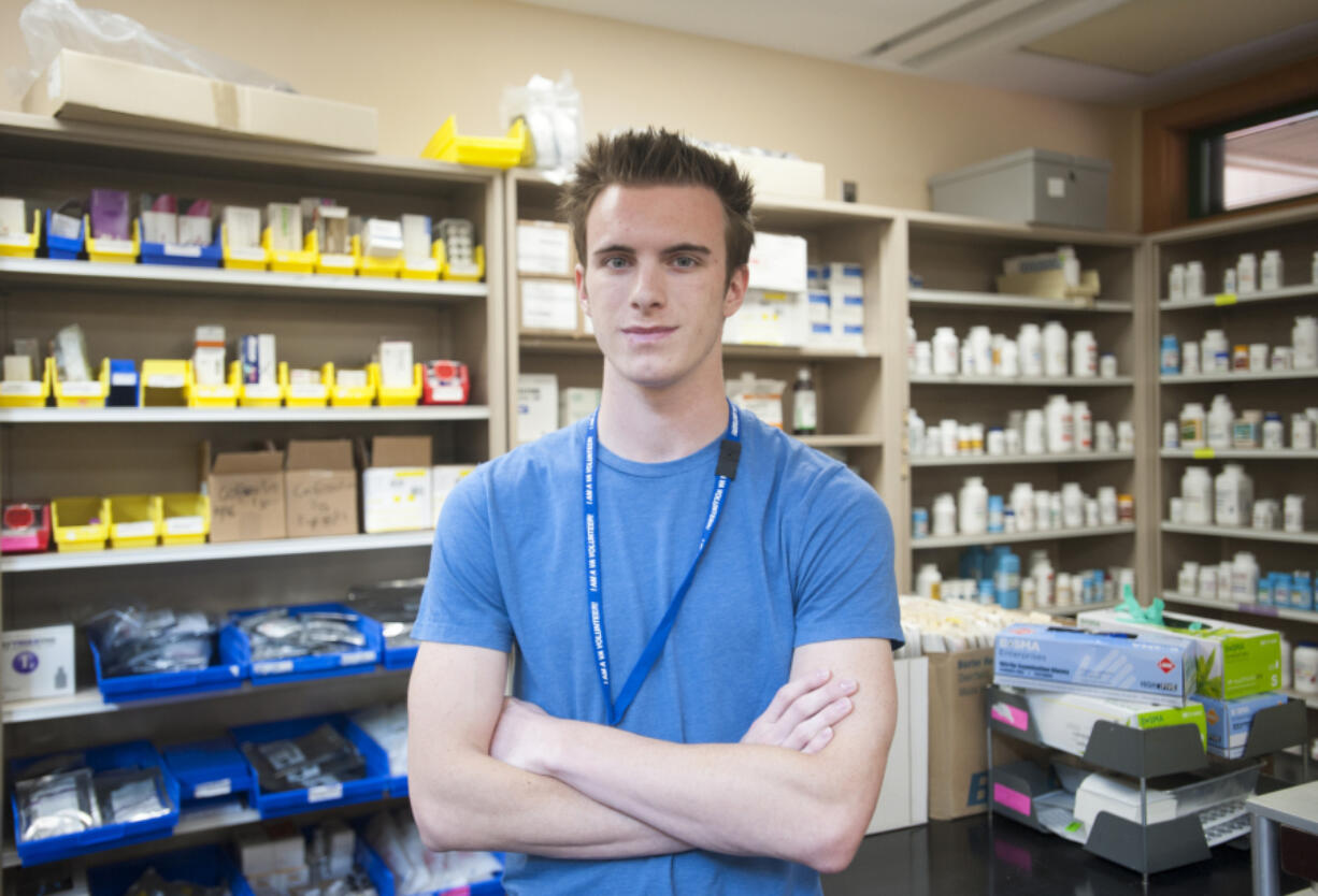 Andrew Lee, 18, senior at Henrietta Lacks Health and Bioscience High School, interns in the pharmacy at the Vancouver Veterans Affairs campus. HeLa High is graduating its first class of seniors, and many are doing health internships in the community.