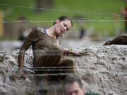 Thousands of people brave mud and barbed wire to take part in the Spartan Sprint at the Washougal MX Park track in Washougal.