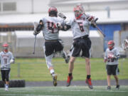 Union&#039;s Jon Stell, left, and Nathan Lindquist react after a goal was scored in a state semifinal lacrosse match against Gonzaga Prep at Camas High School on Wednesday.