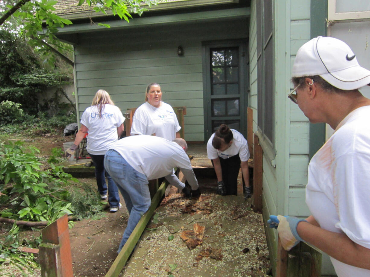 Shumway: Volunteers from Charter Communications built a wheelchair ramp and did some yard cleanup for a Vancouver resident as part of the company&#039;s Charter Our Community program.