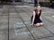 Meadow Homes: Morganne Guier pauses next to an inspirational message that she wrote in the Fort Vancouver High School&#039;s courtyard.