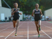 Sisters Jai&#039;Lyn, left, and Dai&#039;Lyn Merriweather finish second and first, respectively, in the women&#039;s 200 meter race during the final day of the Greater St. Helens 4A district championship track meet at McKenzie Stadium in Vancouver on Friday, May 13, 2016.