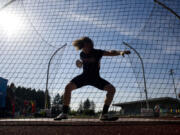 Union senior Bailey King hurls a discus during the final day of the Greater St. Helens 4A district championship track meet at McKenzie Stadium in Vancouver on Friday, May 13, 2016.