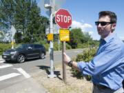 Washington State Department of Transportation spokesman Bart Treece explains on Monday the benefits of an improved crosswalk at the state Highway 14 onramp from Columbia House Boulevard in west Vancouver.