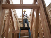 Construction worker Nick Floyd builds a stairway at a new housing development in Felida on Monday. Housing demand in Clark County remains high, with homes on average selling in just 50 days.