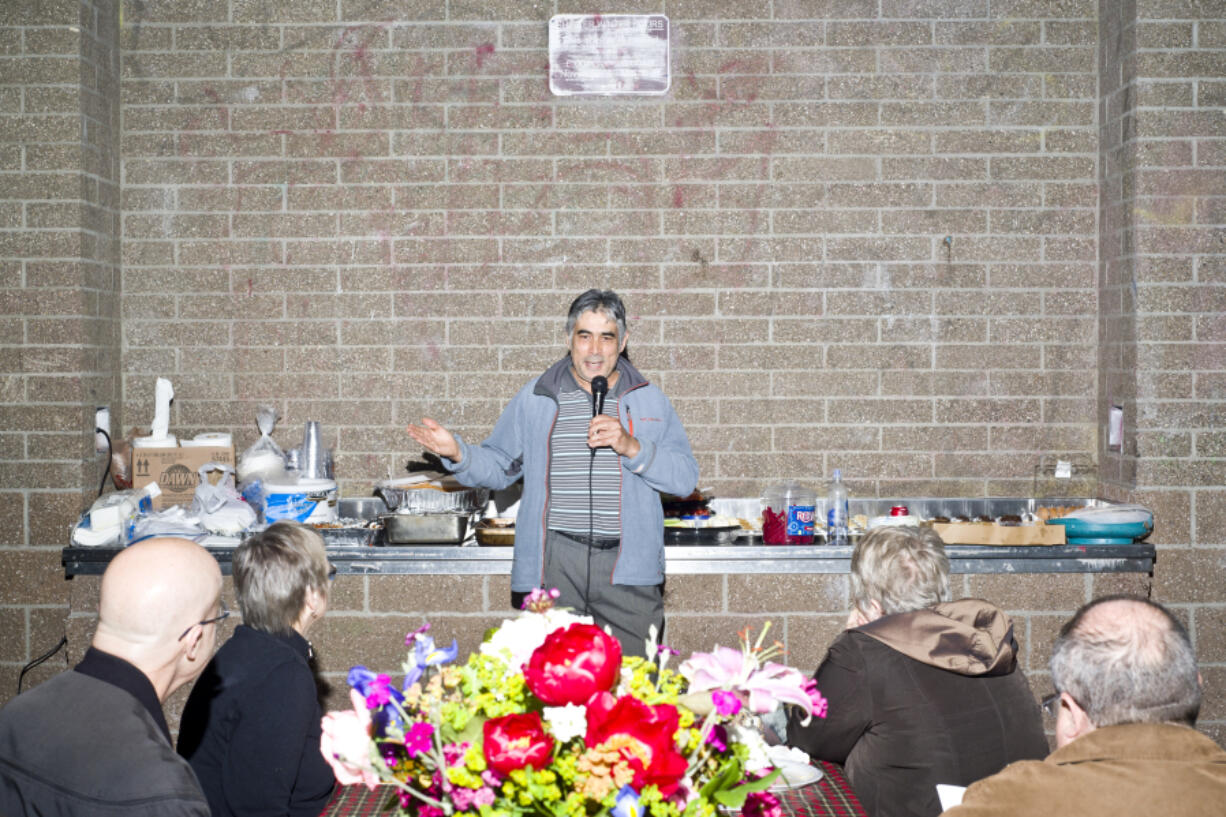 Salah Ansary, director of the Vancouver office of Lutheran Community Services Northwest, speaks Sunday during the Unity Sunday event at Leroy Haagen Memorial Park in Vancouver. The event brought different minority groups together for a potluck and speeches about the importance of unity.