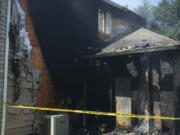 The fire started at the back of the home and moved into the attic, causing extensive damage.