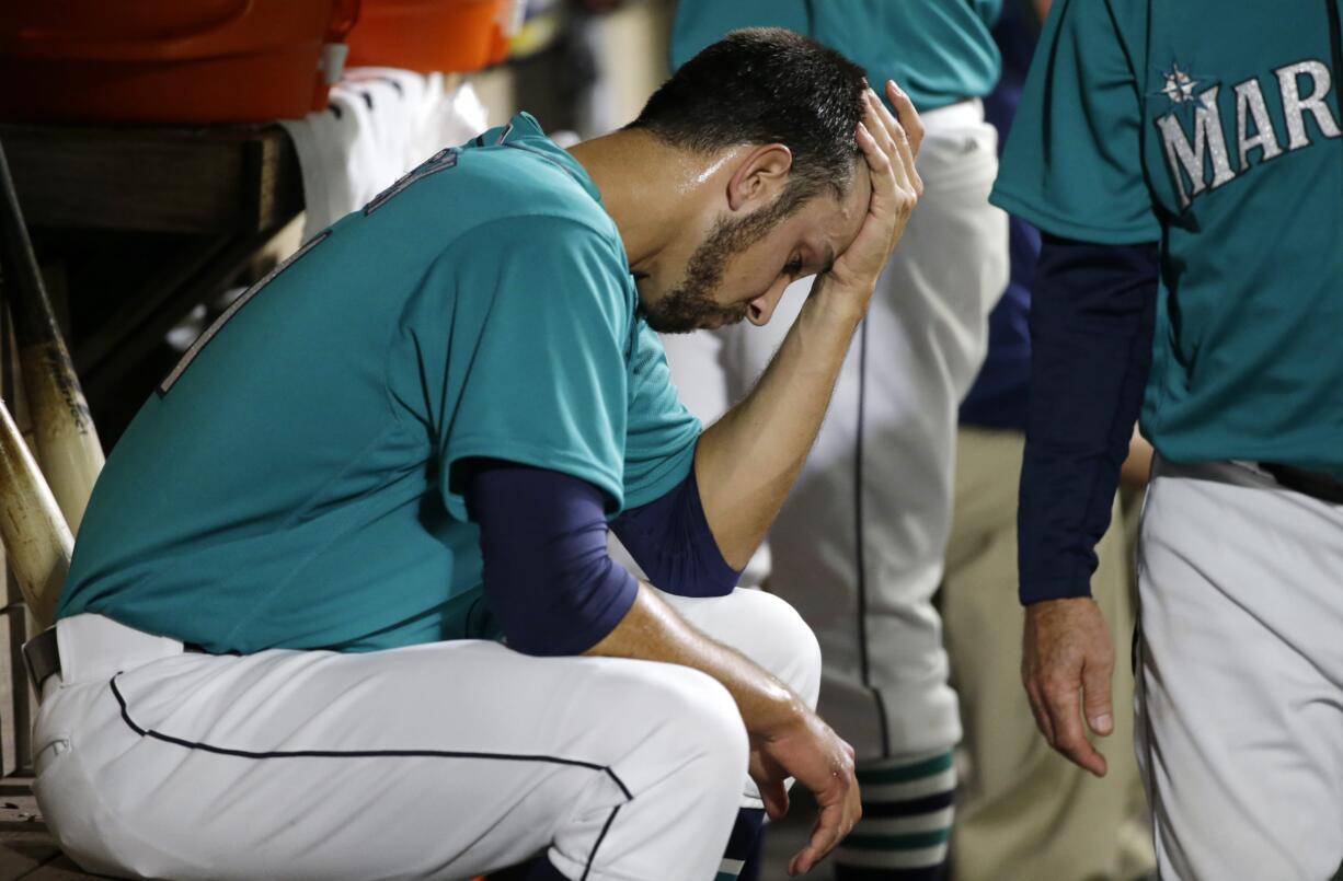 Seattle Mariners closer Steve Cishek sits in the dugout after he blew the save against the Los Angeles Angels in the ninth inning of a baseball game against the Los Angeles Angels, Friday, May 13, 2016, in Seattle. Cishek was also charged with the loss at the Angels beat the Mariners 7-6. (AP Photo/Ted S.