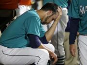 Seattle Mariners closer Steve Cishek sits in the dugout after he blew the save against the Los Angeles Angels in the ninth inning of a baseball game against the Los Angeles Angels, Friday, May 13, 2016, in Seattle. Cishek was also charged with the loss at the Angels beat the Mariners 7-6. (AP Photo/Ted S.