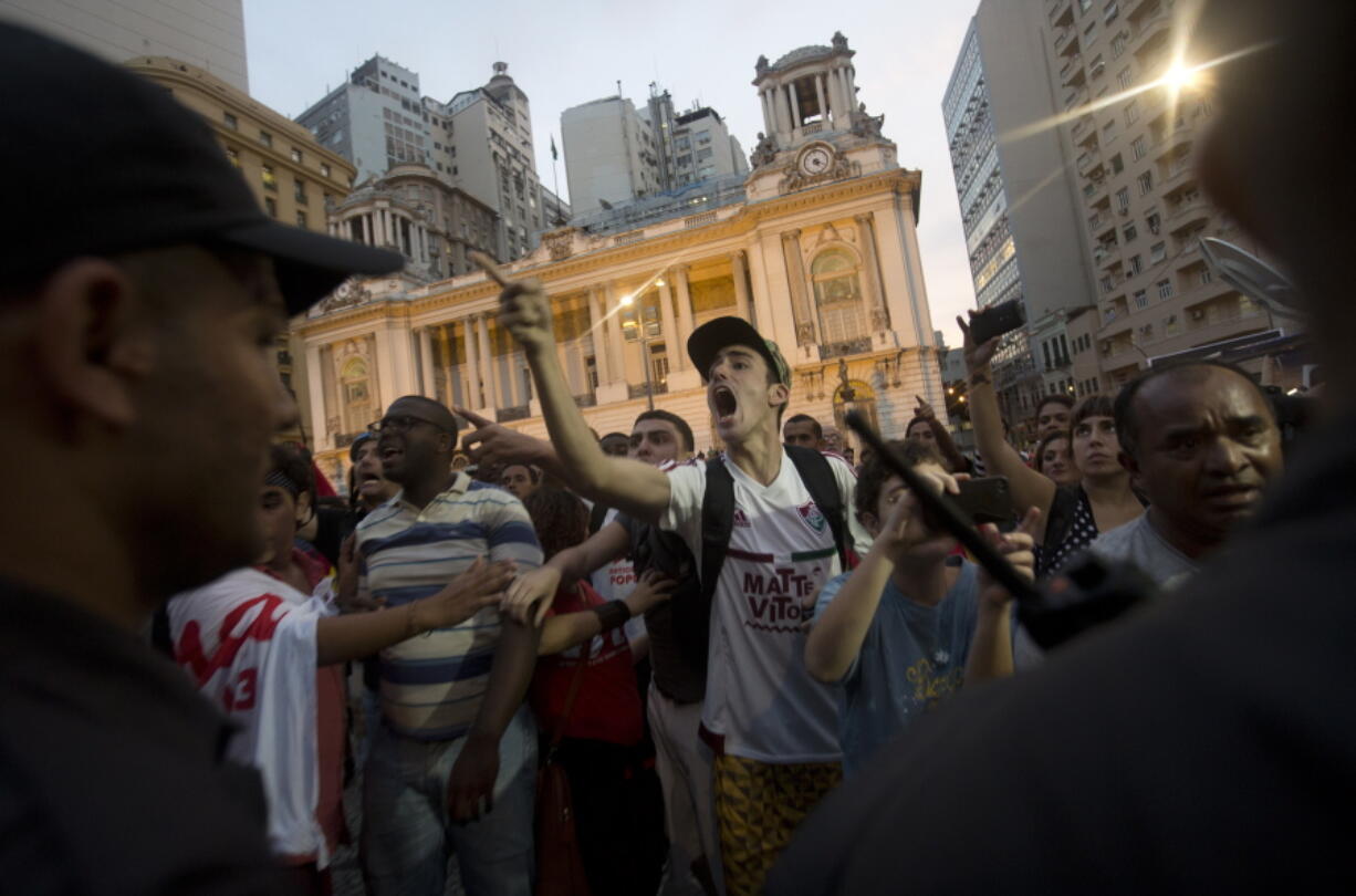 Pro-government demonstrators argue with anti-government protesters about the impeachment of President Dilma Rousseff on Wednesday in Rio de Janeiro, Brazil.