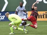 Jack McInerney scored a goal and was effective in applying pressure for the Timbers in their 4-2 win over the Whitecaps on Sunday.