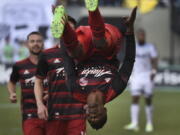 Portland Timbers forward Dairon Asprilla flips after scoring a goal during the second half of an MLS soccer game against the Vancouver Whitecaps in Portland, Ore., on Sunday, May 22, 2016.