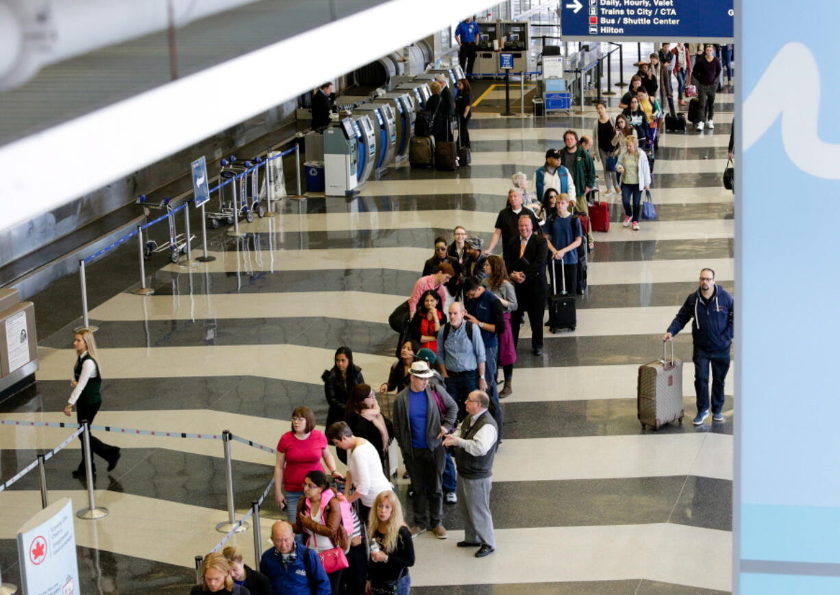 A long line of travelers waiting for the TSA security check point at O&#039;Hare International airport in Chicago. The Transportation Security Administration has ousted its head of security operations and put new leadership in charge of screening operations at a major international airport, but long checkpoint lines and travel headaches already pervading the busy summer travel season are likely to continue.