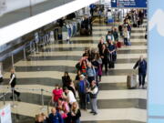 A long line of travelers waiting for the TSA security check point at O&#039;Hare International airport in Chicago. The Transportation Security Administration has ousted its head of security operations and put new leadership in charge of screening operations at a major international airport, but long checkpoint lines and travel headaches already pervading the busy summer travel season are likely to continue.