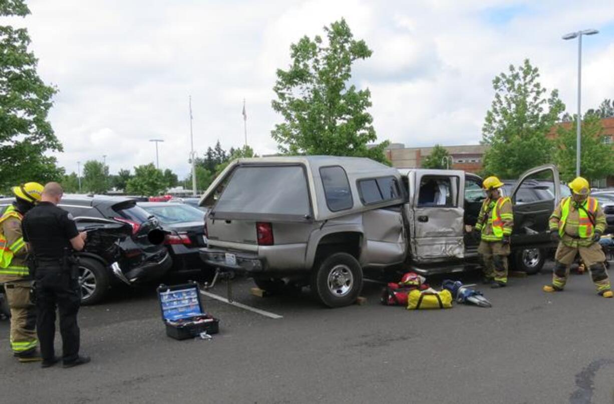 Battle Ground police are investigating after the driver of a pickup crashed into ix vehicles parked at Chief Umtuch Middle School Friday morning.