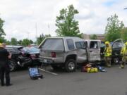 Battle Ground police are investigating after the driver of a pickup crashed into ix vehicles parked at Chief Umtuch Middle School Friday morning.