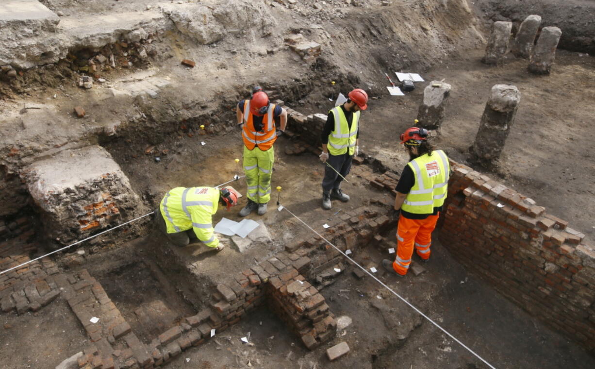 Archaeologists work on the exposed remains as the site of Shakespeare&#039;s Curtain Theatre is excavated in Shoreditch in London, Tuesday, May 17, 2016.  Archaeologists are excavating the remains of the Curtain, a 16th-century theater where some of the Bard&#039;s play&#039;s were staged, before another gleaming tower joins the city&#039;s crowded skyline.