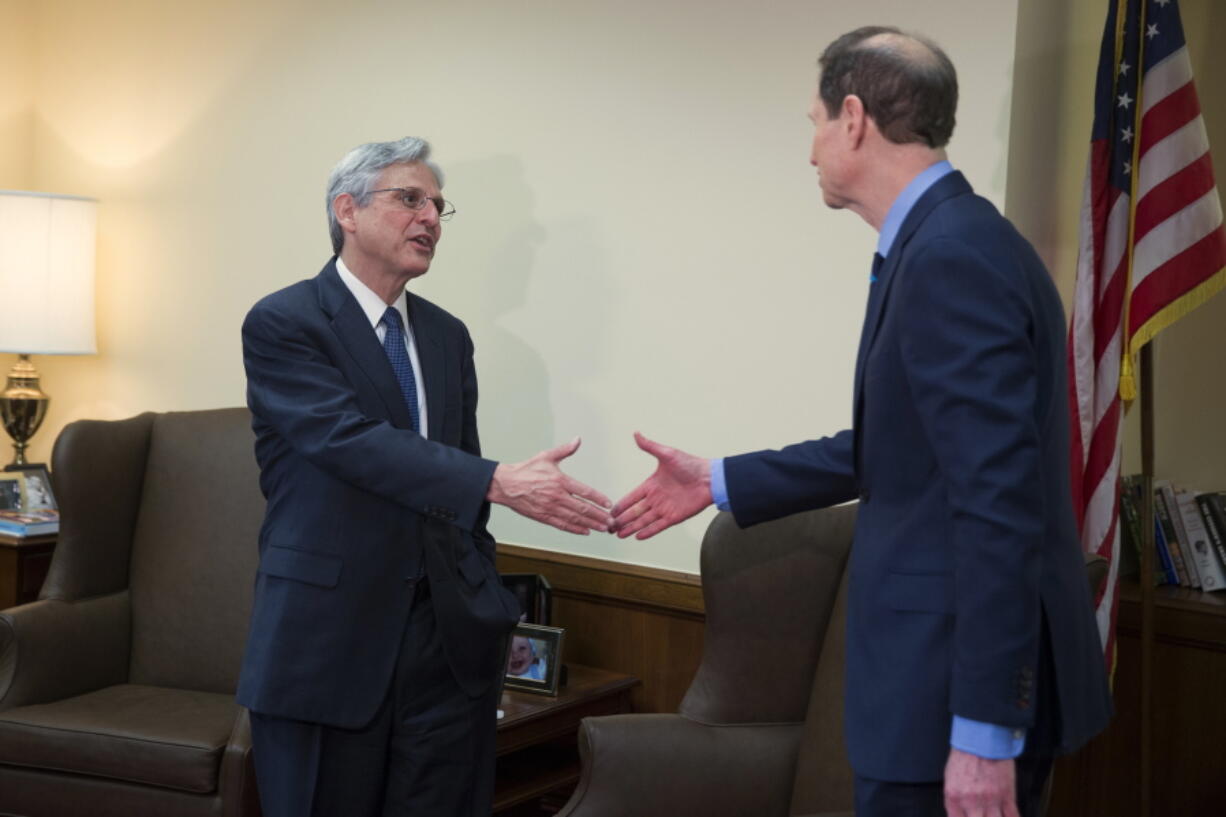 Judge Merrick Garland, President Barack Obama&#039;s choice to replace the late Justice Antonin Scalia on the Supreme Court, left, meets with Sen. Ron Wyden, D-Ore., on Capitol Hill, on April 28 in Washington.