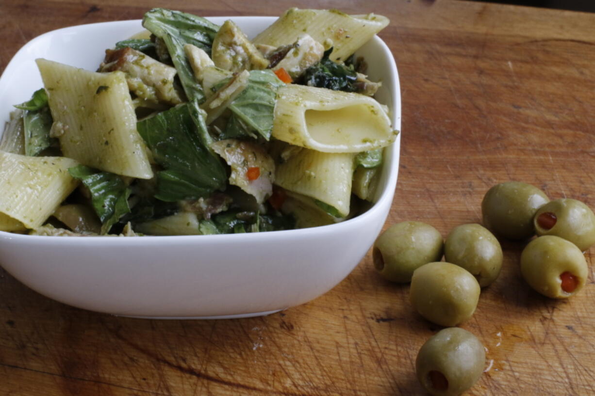 Pasta salad with chicken, green olives and ramp vinaigrette (AP Photo/J.M.