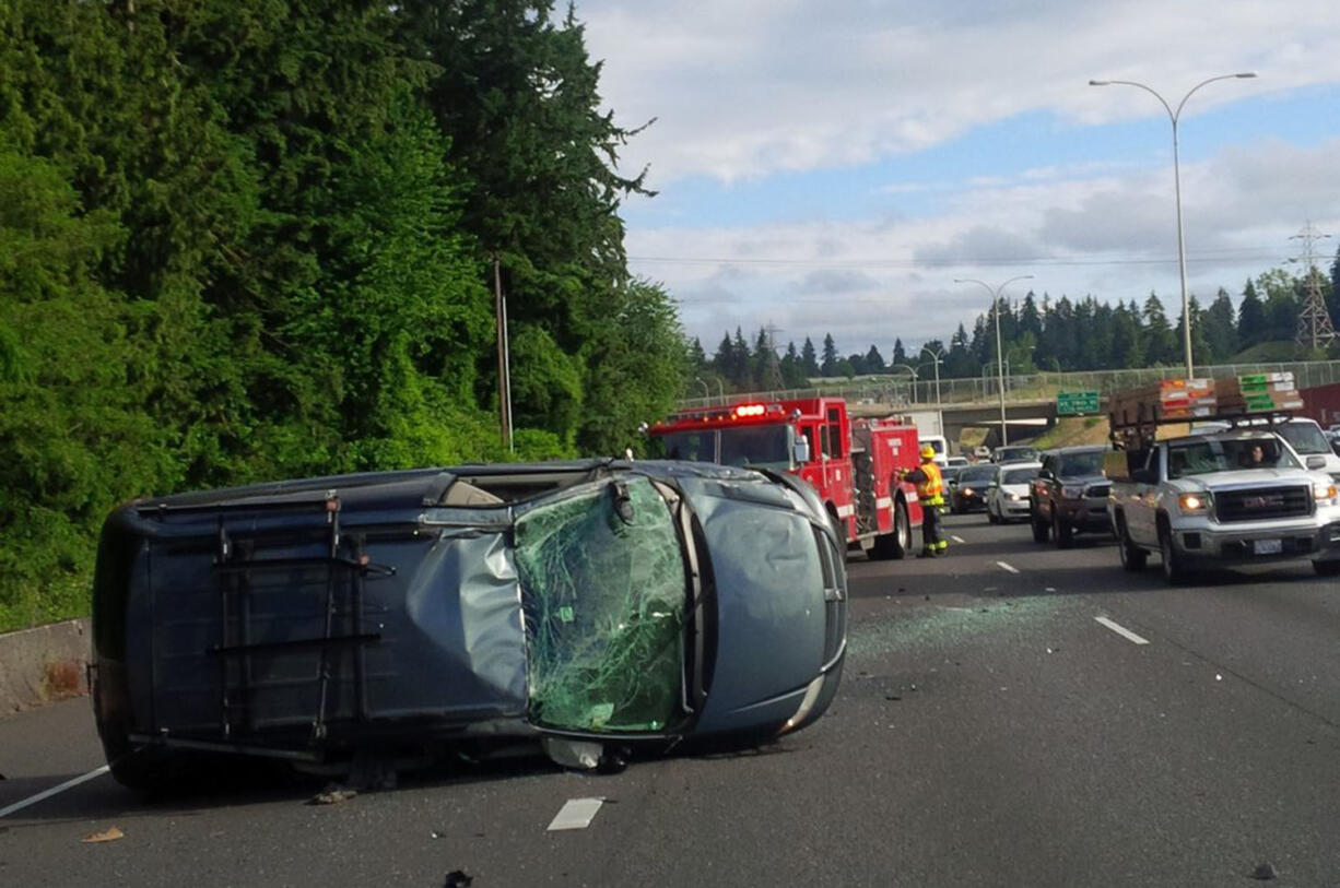 Traffic on Interstate 5 southbound is backed up after a rollover crash was reported this morning near Main Street. Troopers say that the preliminary investigation shows that a distracted driver caused the crash.