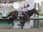 Mario Guitierrez rides Nyquist to victory during the 142nd running of the Kentucky Derby horse race at Churchill Downs Saturday, May 7, 2016, in Louisville, Ky.